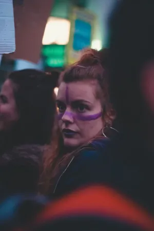 Protestor With Purple Face Paint