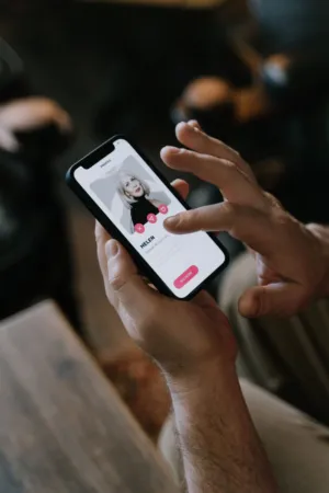 Hand Holding Smartphone With Dating App Profile