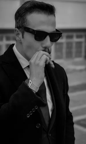 Man In Suit With Cigar