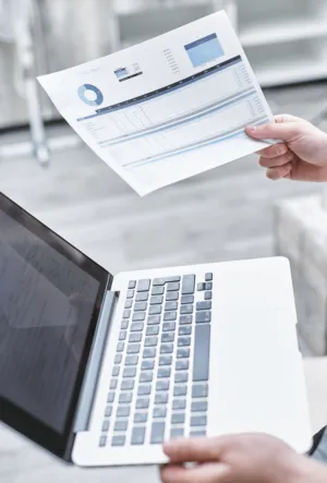 Person Holding A Printed Financial Report