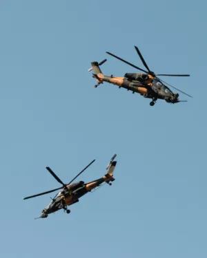 Military Helicopters In Flight
