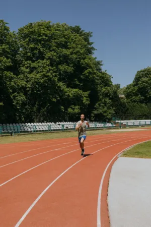 Athlete Running On Track
