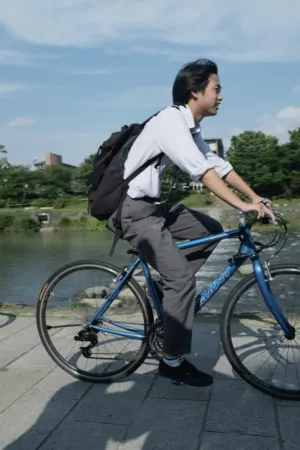 Bicyclist By The River