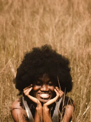 Smiling Woman In A Field