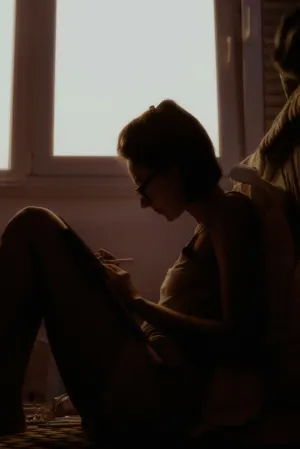 Silhouette Of A Woman Sketching
