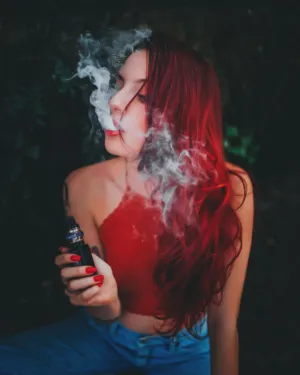 Red-Haired Woman With Smoke