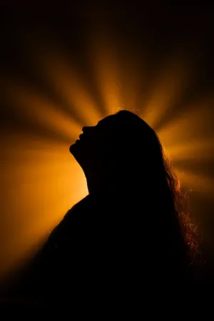 Silhouette Of A Woman With Light Beams