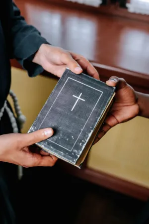 Hands Holding A Bible
