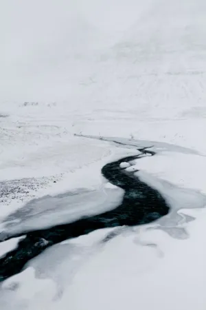 Frozen River In Winter Landscape