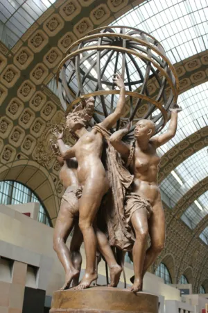 Statue Of Women Holding A Globe