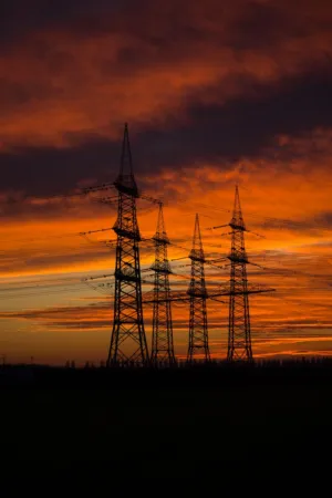 Electricity Pylons At Sunset