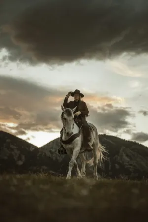 Cowgirl At Sunset