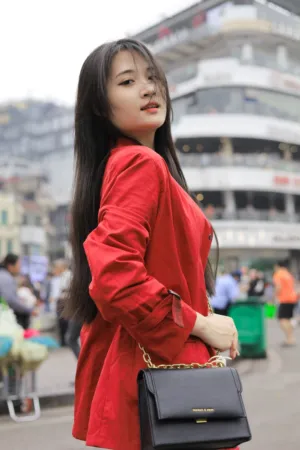 Red Jacket And Black Bag