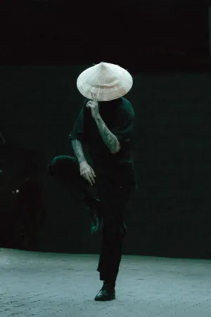 Tattooed Man With Conical Hat