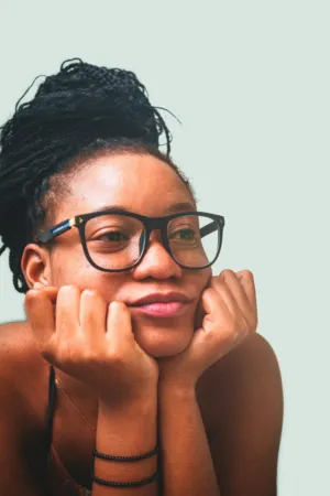 Young Woman With Braids And Glasses