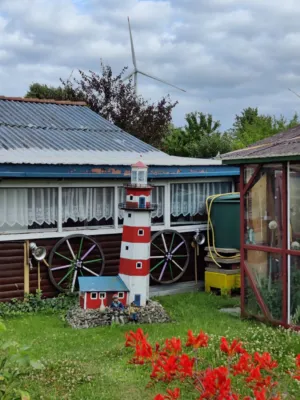 Garden With Windmill And Lighthouse