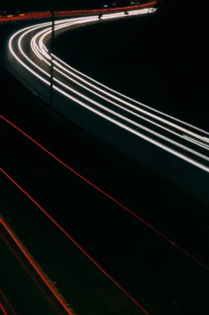 Light Trails On A Curving Highway At Night