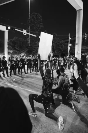 Protesters Kneeling With Signs