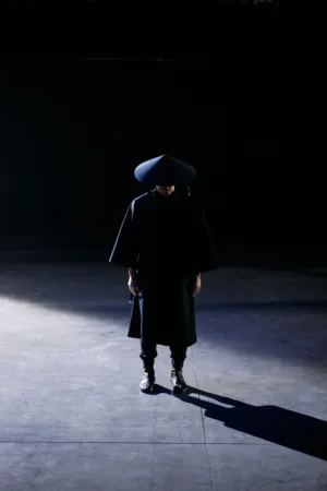 Dark Figure In Minimalist Setting