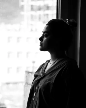 Silhouette Of A Woman By A Window