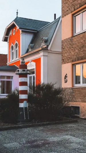 Colorful House With Striped Column
