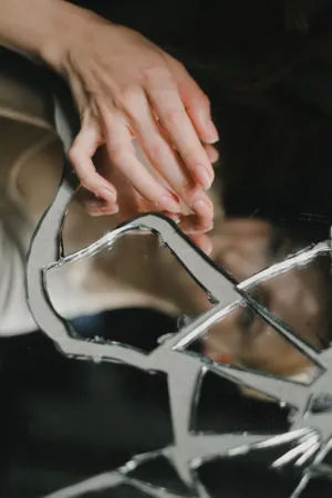 Hand On Broken Mirror