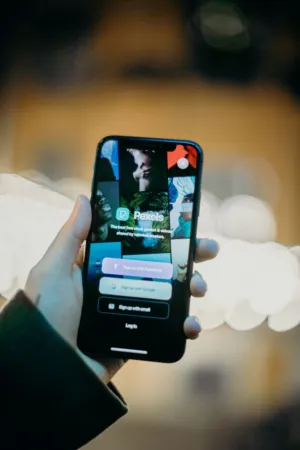 Hand Holding Smartphone With Pexels App