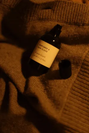 Perfume Bottle On Knit Sweater