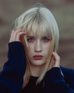 Blonde Model In Blue Sweater