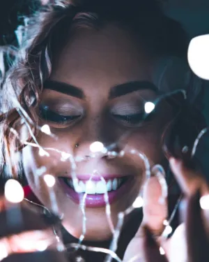 Smiling Woman With Fairy Lights
