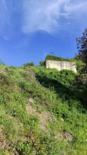 Green Hillside With Concrete Structure