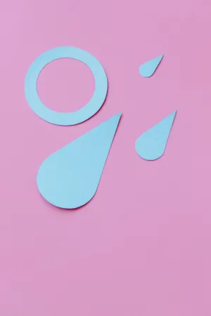 Blue Water Droplets On Pink Background