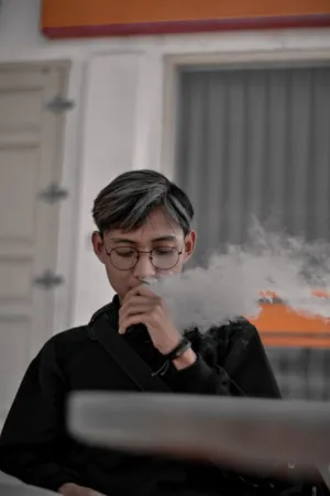 Man With Glasses Smoking