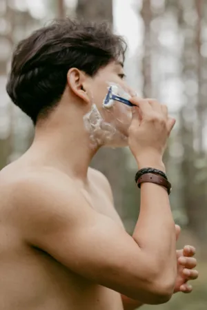 Man Shaving In Nature