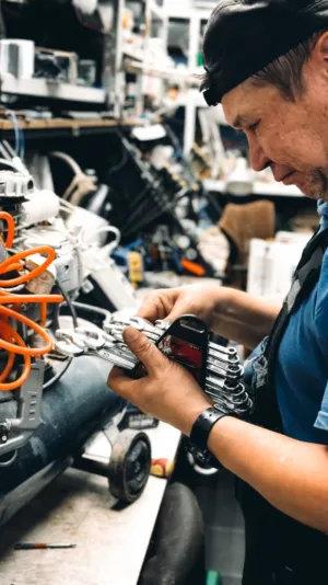 Mechanic Working On A Motorcycle