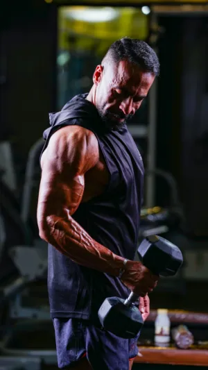 Muscular Man Lifting Dumbbells