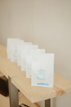 Coffee Bags On A Wooden Shelf