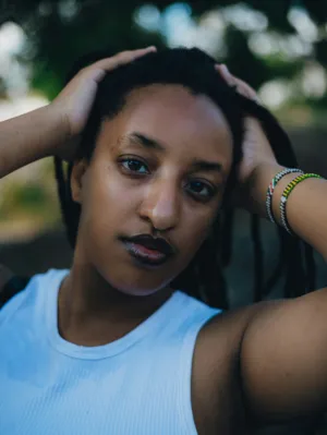 Portrait Of A Woman With Dreadlocks