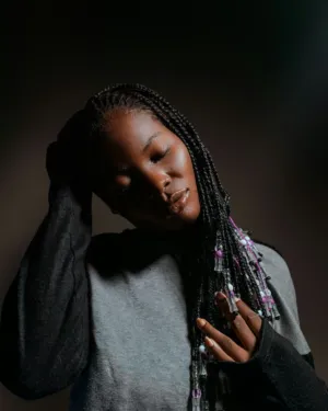 Portrait Of A Woman With Braids