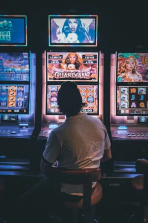Person Playing Slot Machines
