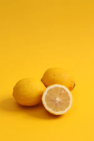 Lemons On Yellow Background