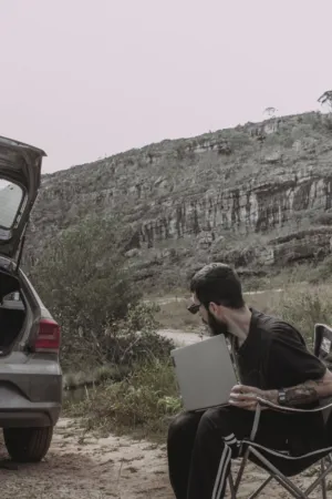 Man With Laptop In Nature