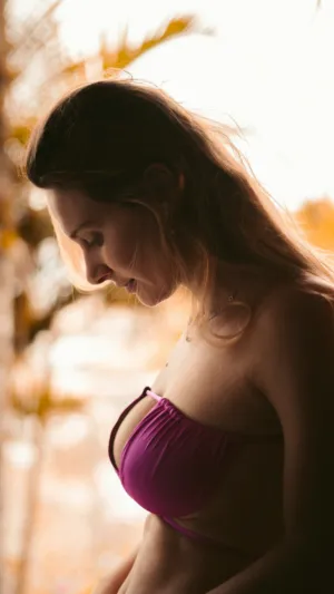 Sunlit Model In Purple Bikini