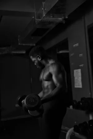 Muscular Man Lifting Dumbbells