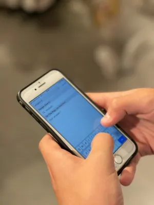 Hand Holding Iphone With Keyboard