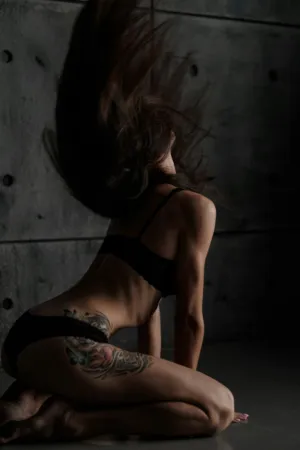 Tattooed Model In Black Lingerie