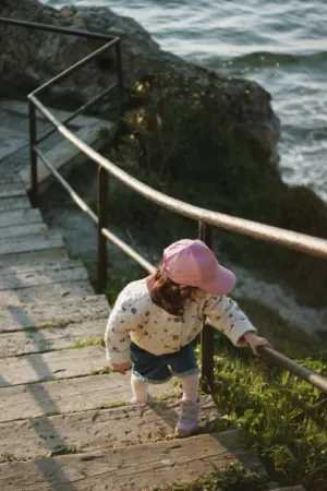 Child Climbing Stairs By The Sea