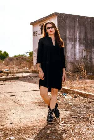 Black Dress And Boots In Abandoned Setting