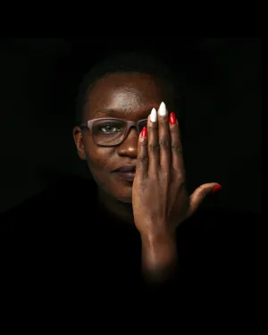 Portrait Of A Woman With Hand Covering Face