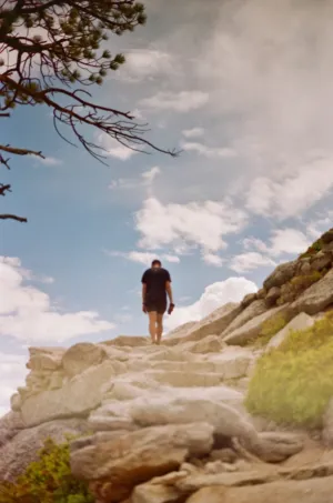 Hiker On Rocky Path